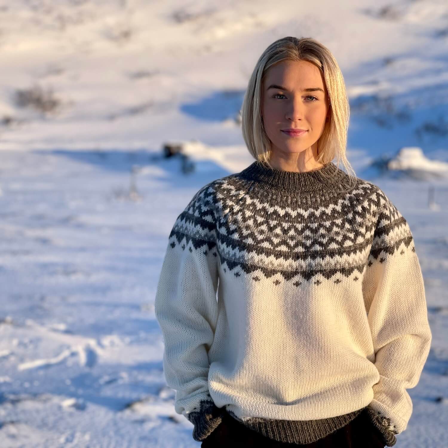 skjaldbreiÃ°ur-icelandic-woman-white-wool-sweater-snow.jpeg